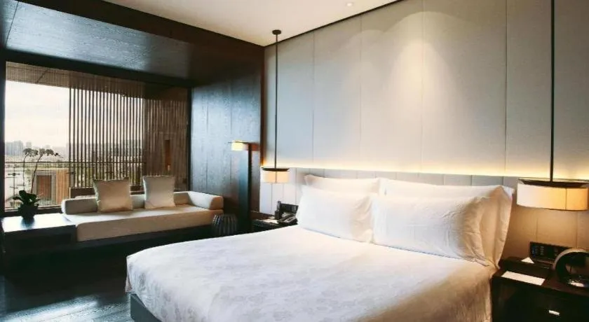 Bed in OCT Bay Breeze Hotel