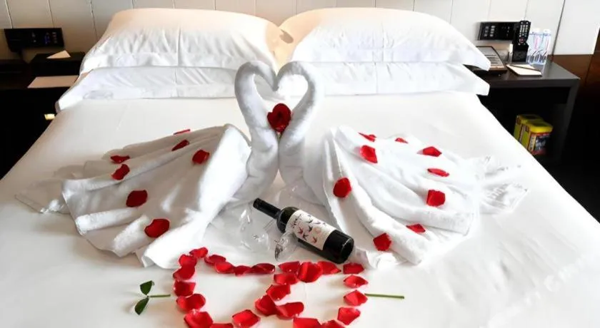 Bed in OCT Bay Breeze Hotel