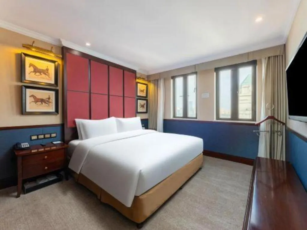 Bed in Grand Skylight Hotel KaiMei