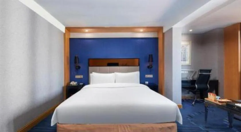 Bed in Grand Skylight Hotel KaiMei