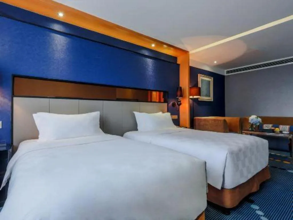 Bed in Grand Skylight Hotel KaiMei