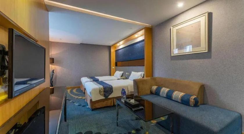 Bed in Grand Skylight Hotel KaiMei