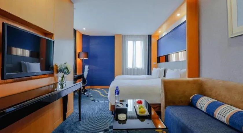 Bed in Grand Skylight Hotel KaiMei