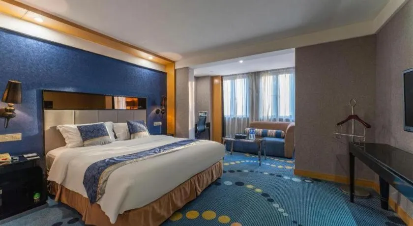 Bed in Grand Skylight Hotel KaiMei