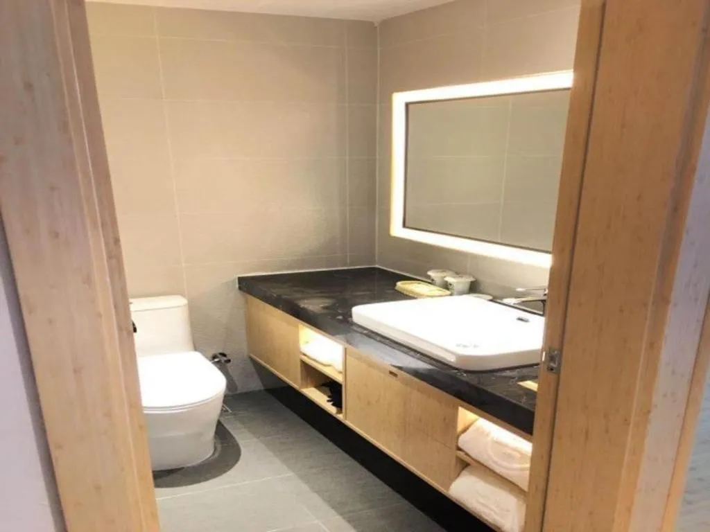 Bed in GreenTree Inn Lianyungang Suning Square Hualian Mantion Hotel