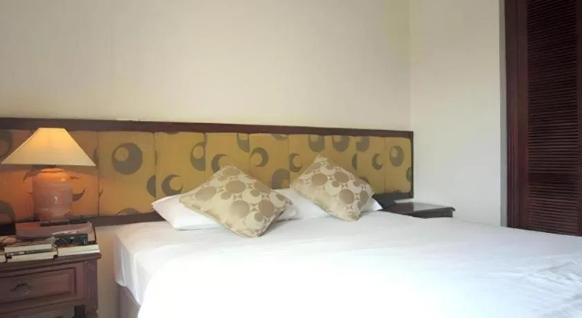 Bed in Golden Ant Hotels