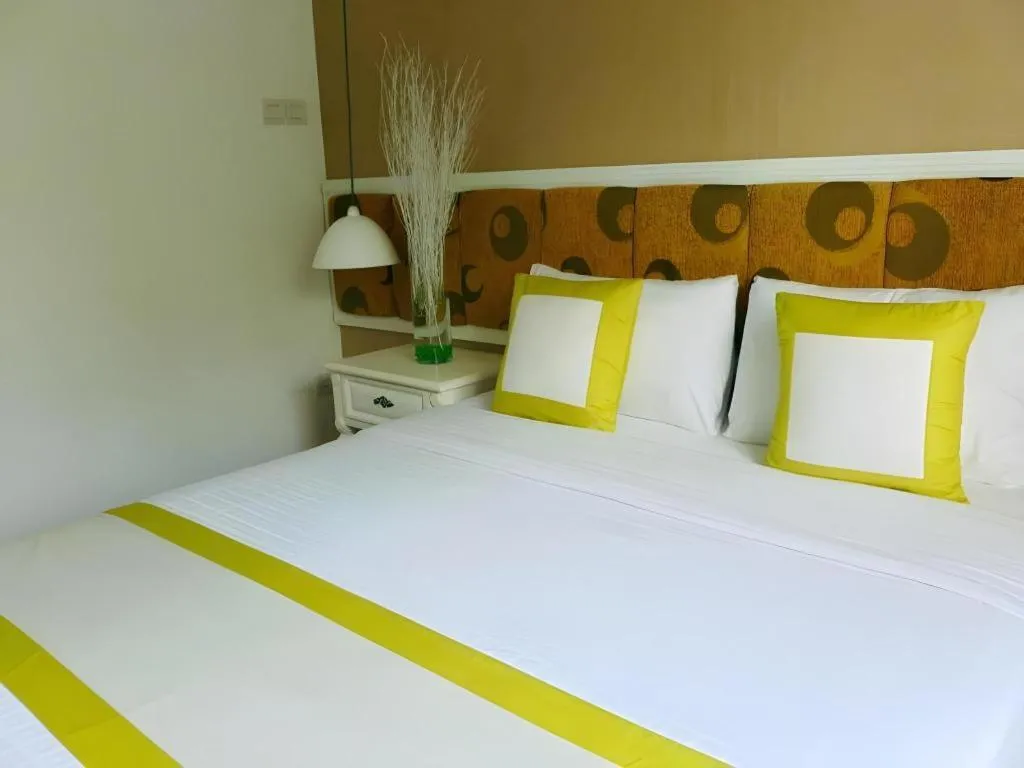 Bed in Golden Ant Hotels