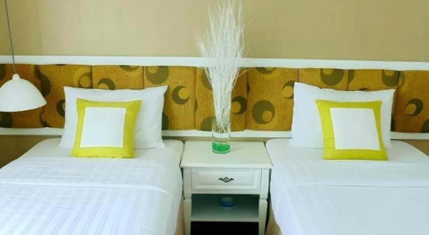 Bed in Golden Ant Hotels