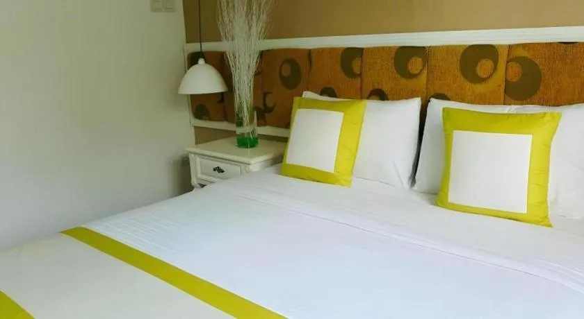 Bed in Golden Ant Hotels