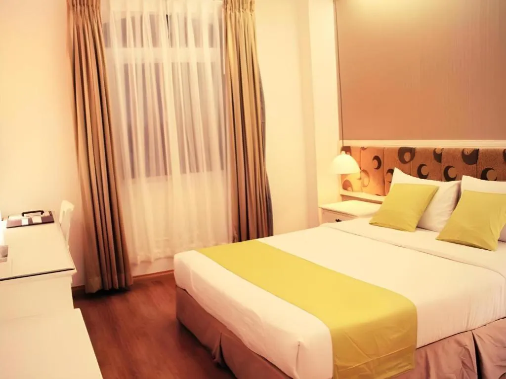 Bed in Golden Ant Hotels