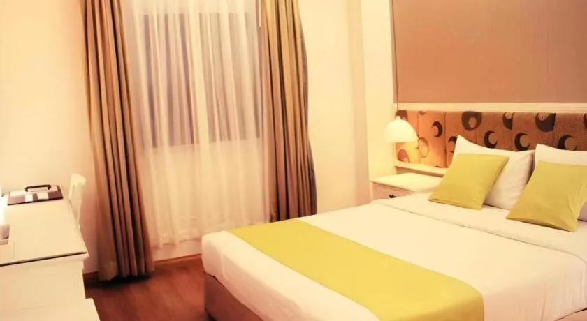 Bed in Golden Ant Hotels