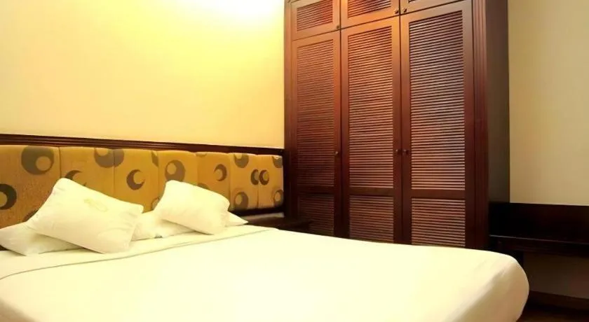 Bed in Golden Ant Hotels