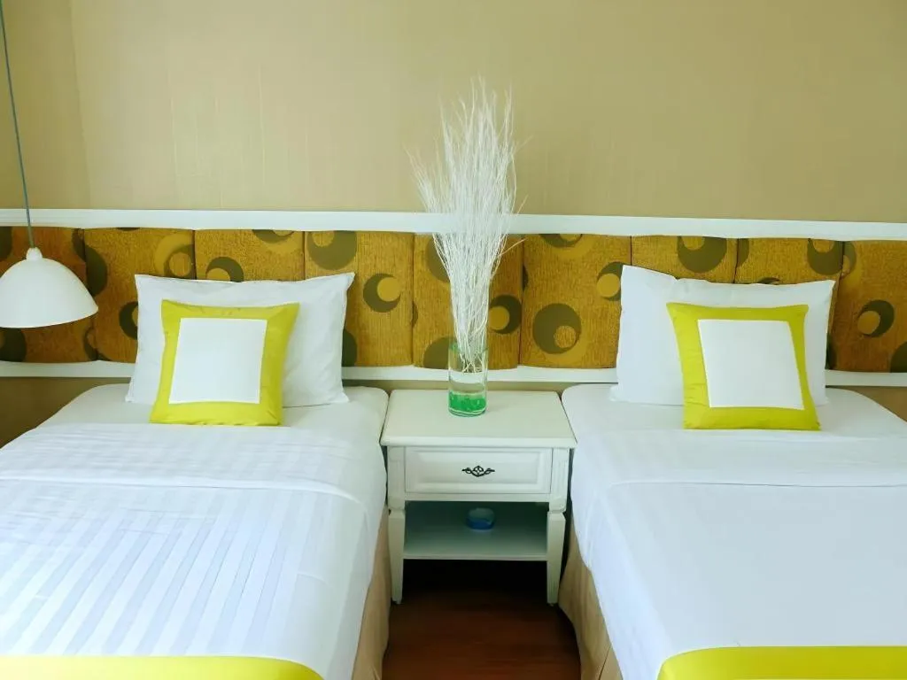 Bed in Golden Ant Hotels