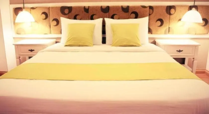 Bed in Golden Ant Hotels