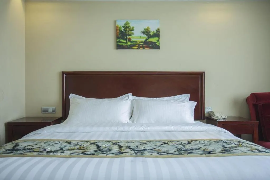 Bed in GreenTree Inn Taizhou Gaogang District Business Hotel