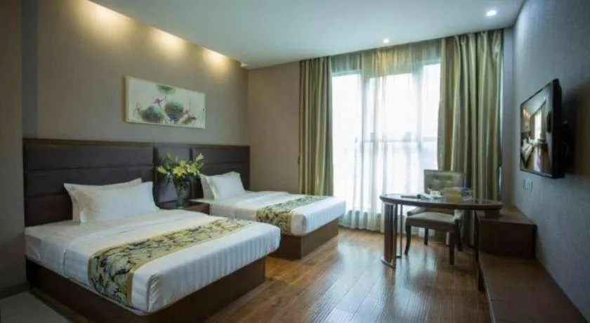 Bed in GreenTree Inn Taizhou Gaogang District Business Hotel