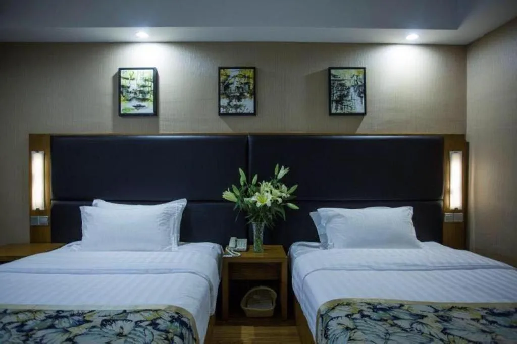 Bed in GreenTree Inn Taizhou Gaogang District Business Hotel