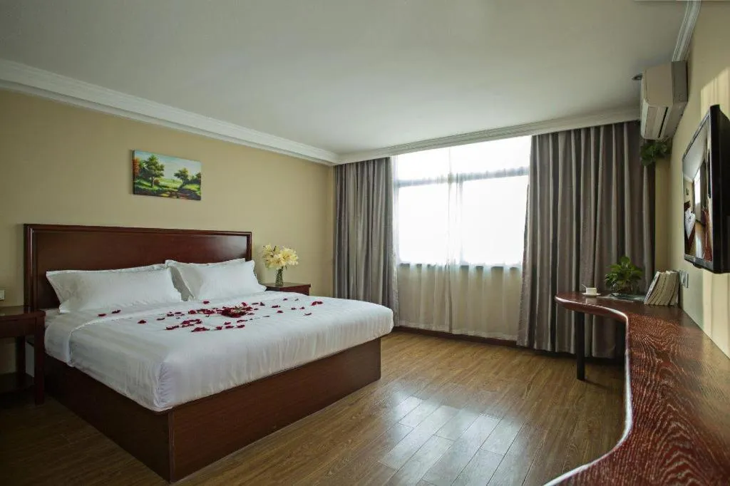 Bed in GreenTree Inn Taizhou Gaogang District Business Hotel