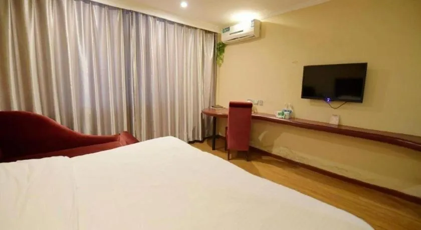 Bed in GreenTree Inn Taizhou Gaogang District Business Hotel