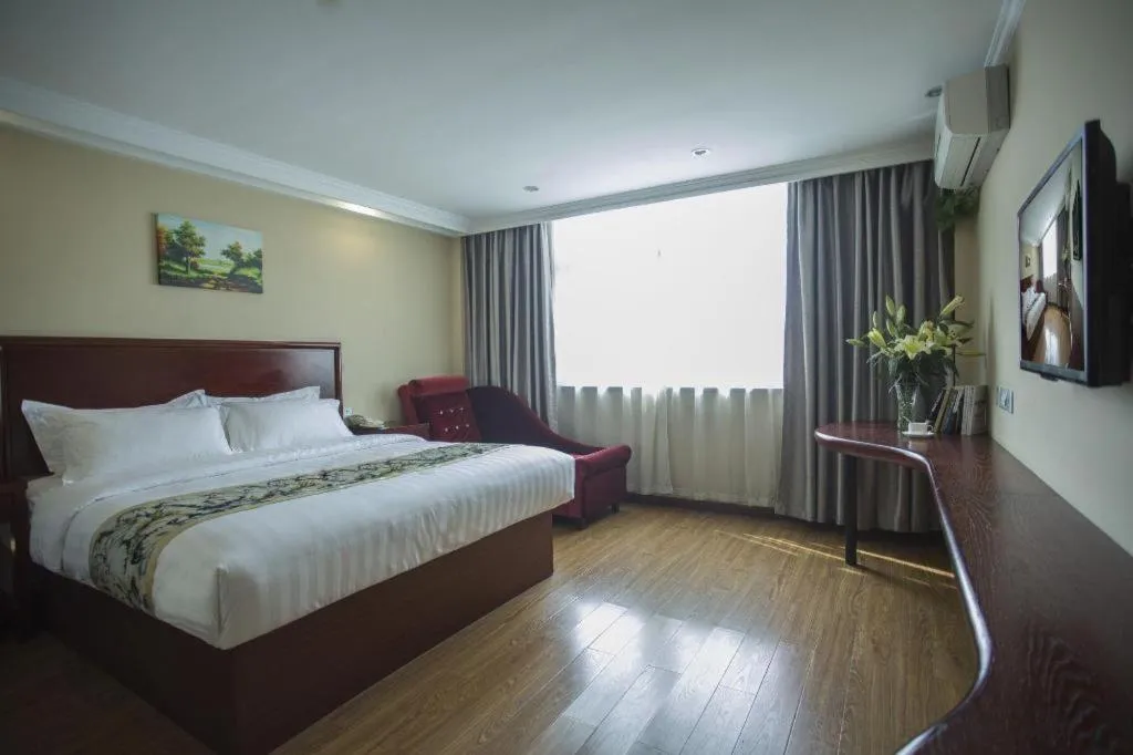 Bed in GreenTree Inn Taizhou Gaogang District Business Hotel