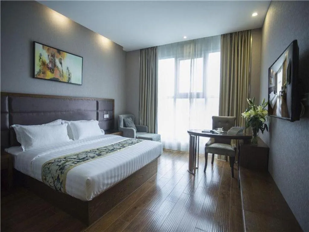 Bed in GreenTree Inn Taizhou Gaogang District Business Hotel