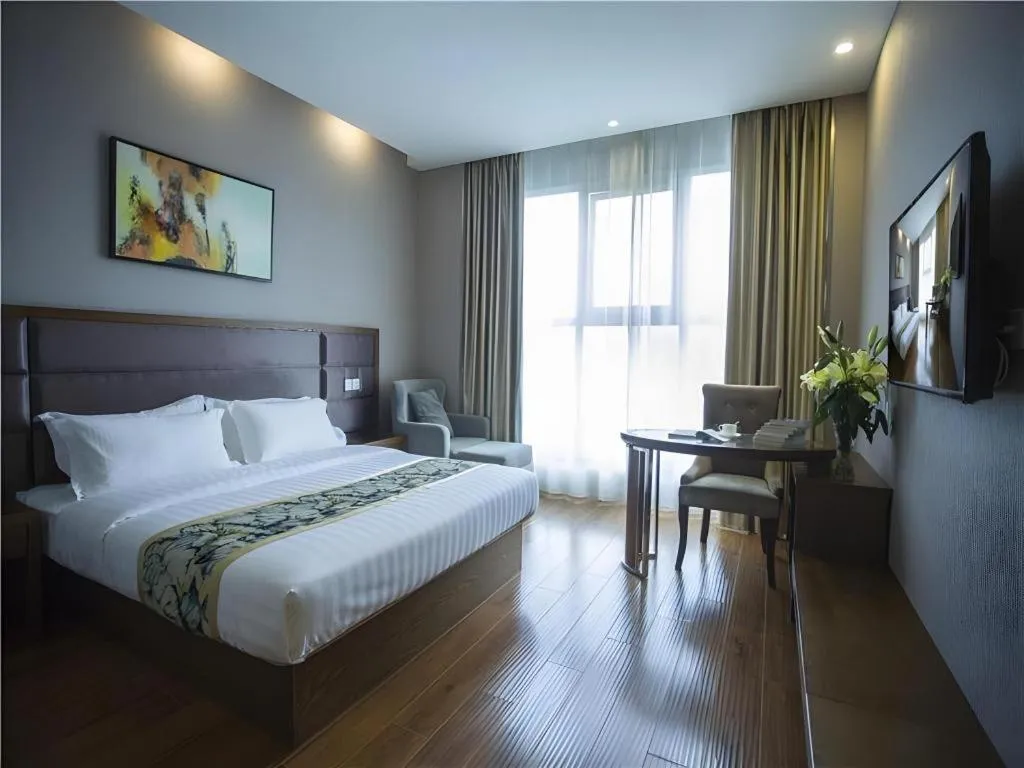 Bed in GreenTree Inn Taizhou Gaogang District Business Hotel