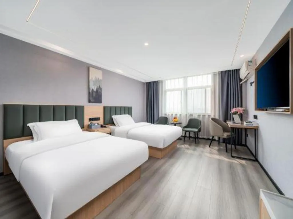 Bed in GreenTree Inn Taizhou Gaogang District Business Hotel