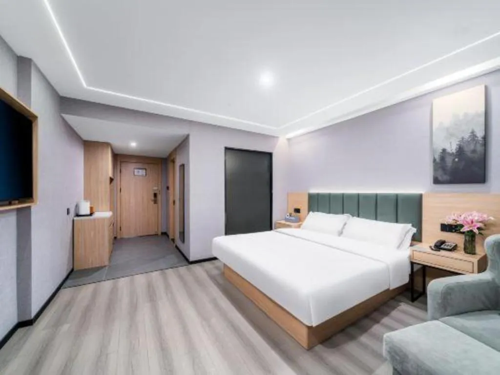 Bed in GreenTree Inn Taizhou Gaogang District Business Hotel