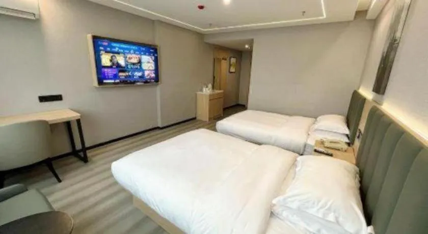 Bed in GreenTree Inn Taizhou Gaogang District Business Hotel