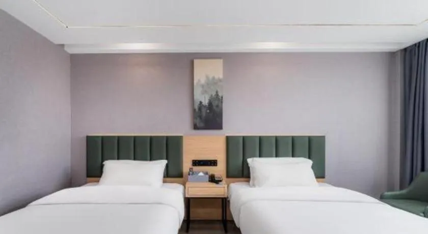 Bed in GreenTree Inn Taizhou Gaogang District Business Hotel