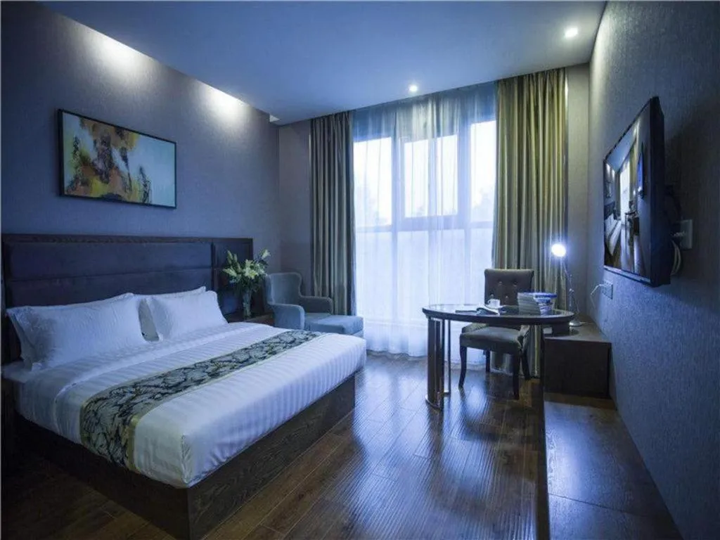 Bed in GreenTree Inn Taizhou Gaogang District Business Hotel