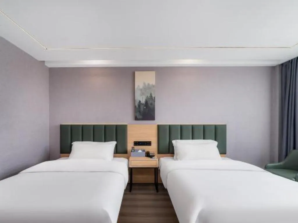 Bed in GreenTree Inn Taizhou Gaogang District Business Hotel