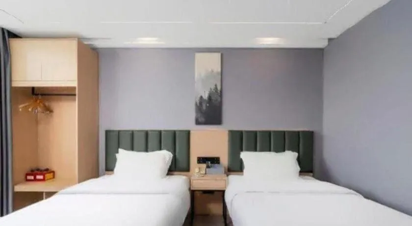 Bed in GreenTree Inn Taizhou Gaogang District Business Hotel