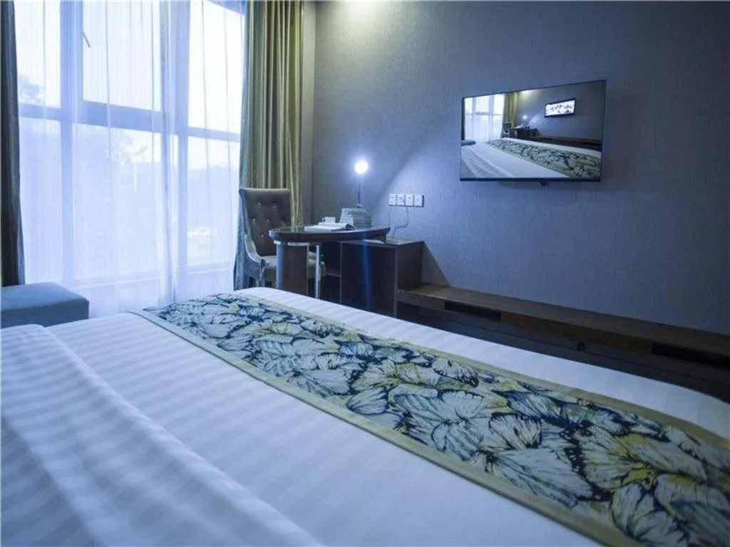 Bed in GreenTree Inn Taizhou Gaogang District Business Hotel