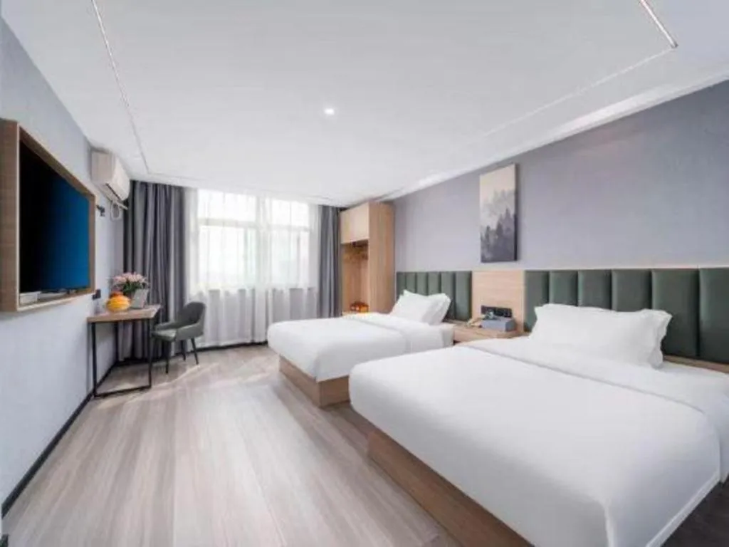 Bed in GreenTree Inn Taizhou Gaogang District Business Hotel