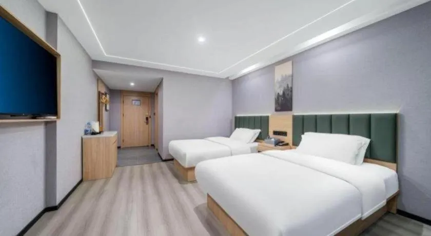 Bed in GreenTree Inn Taizhou Gaogang District Business Hotel