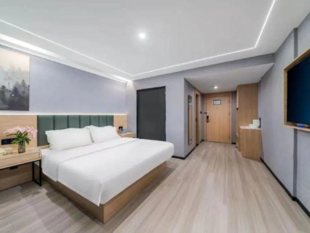 Bed in GreenTree Inn Taizhou Gaogang District Business Hotel