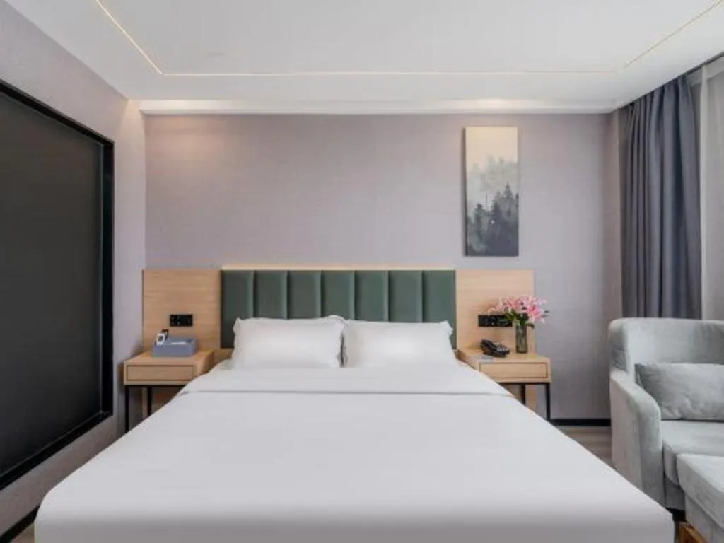 Bed in GreenTree Inn Taizhou Gaogang District Business Hotel
