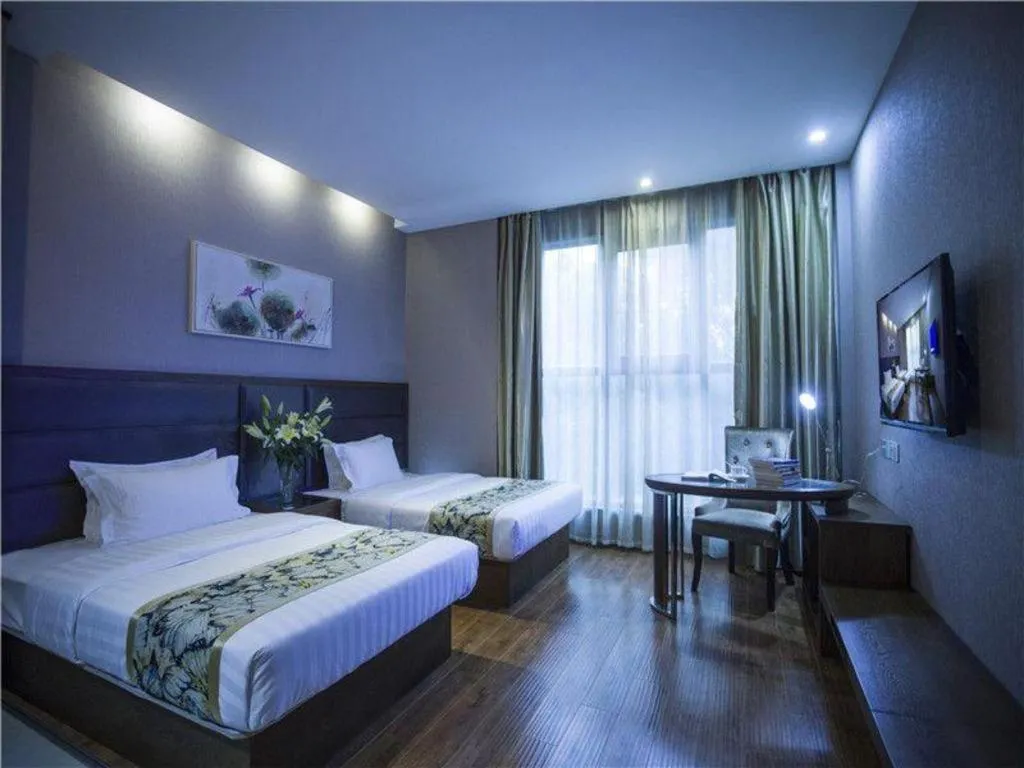 Bed in GreenTree Inn Taizhou Gaogang District Business Hotel