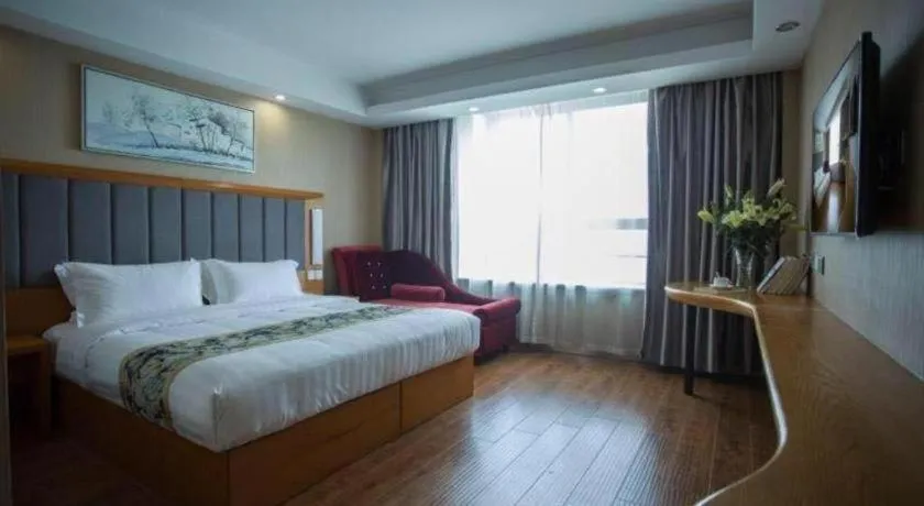 Bed in GreenTree Inn Taizhou Gaogang District Business Hotel