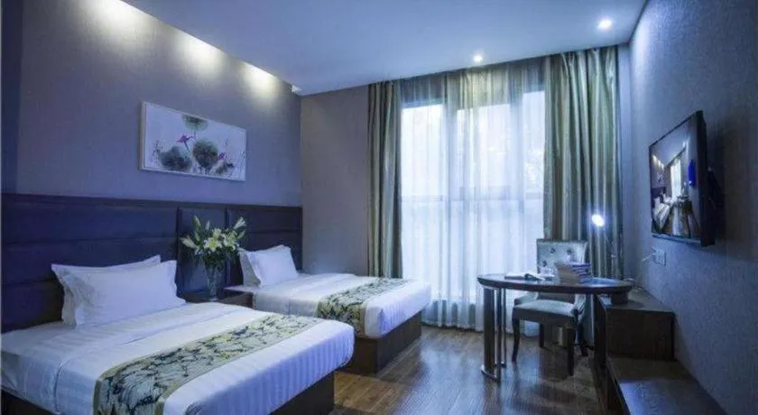 Bed in GreenTree Inn Taizhou Gaogang District Business Hotel