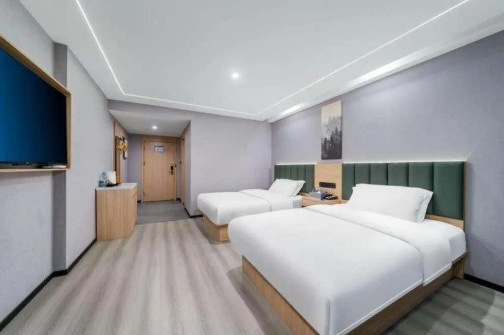 Bed in GreenTree Inn Taizhou Gaogang District Business Hotel