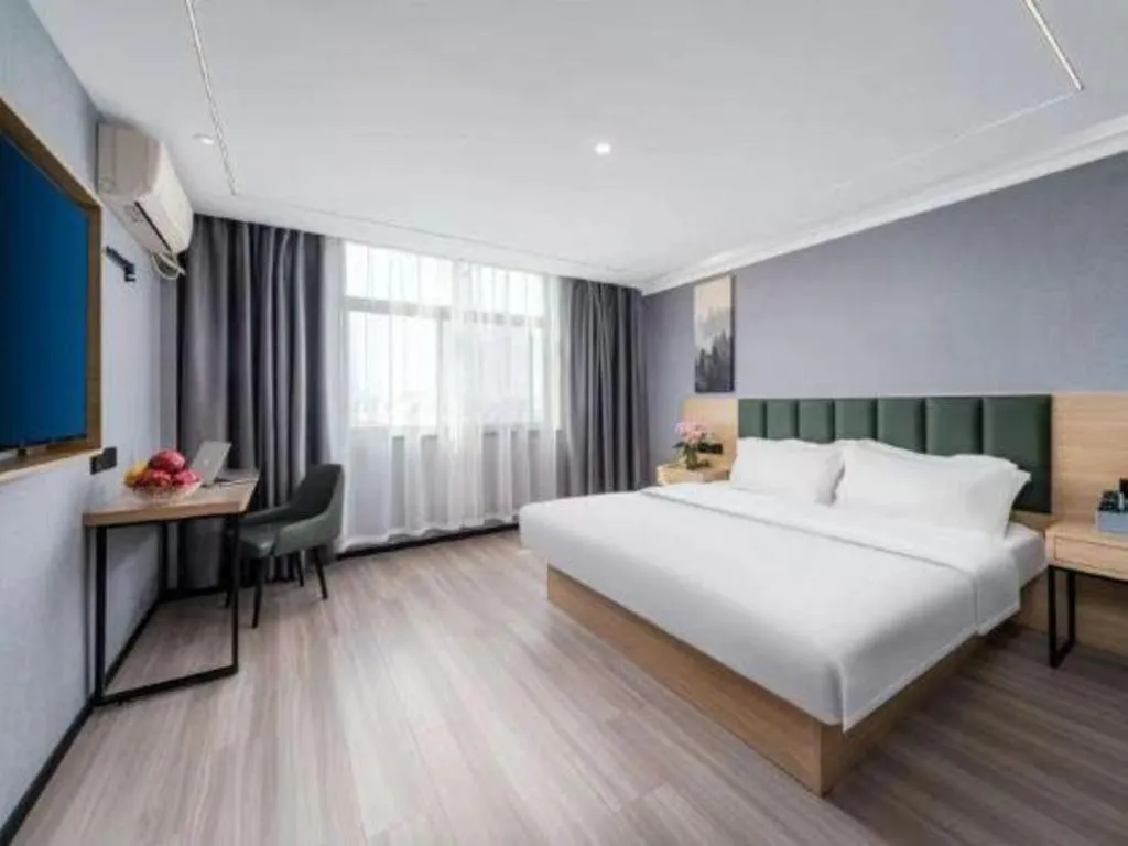 Bed in GreenTree Inn Taizhou Gaogang District Business Hotel