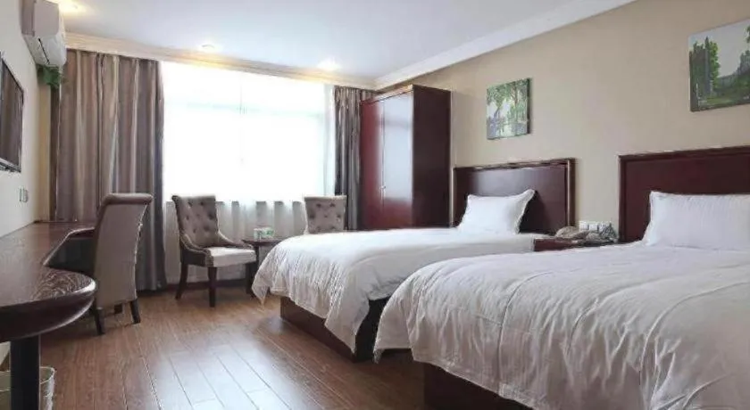 Bed in GreenTree Inn Taizhou Gaogang District Business Hotel