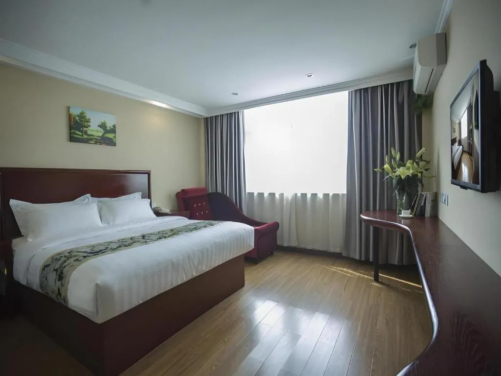 Bed in GreenTree Inn Taizhou Gaogang District Business Hotel