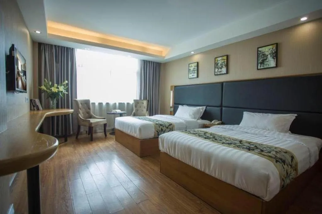 Bed in GreenTree Inn Taizhou Gaogang District Business Hotel