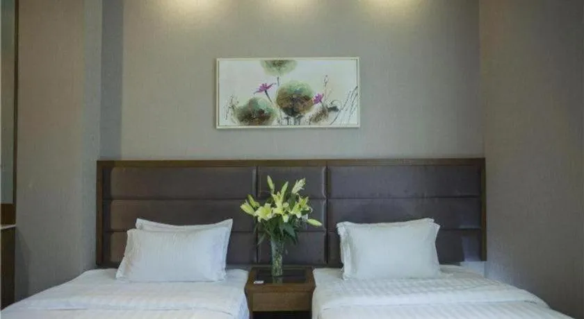 Bed in GreenTree Inn Taizhou Gaogang District Business Hotel