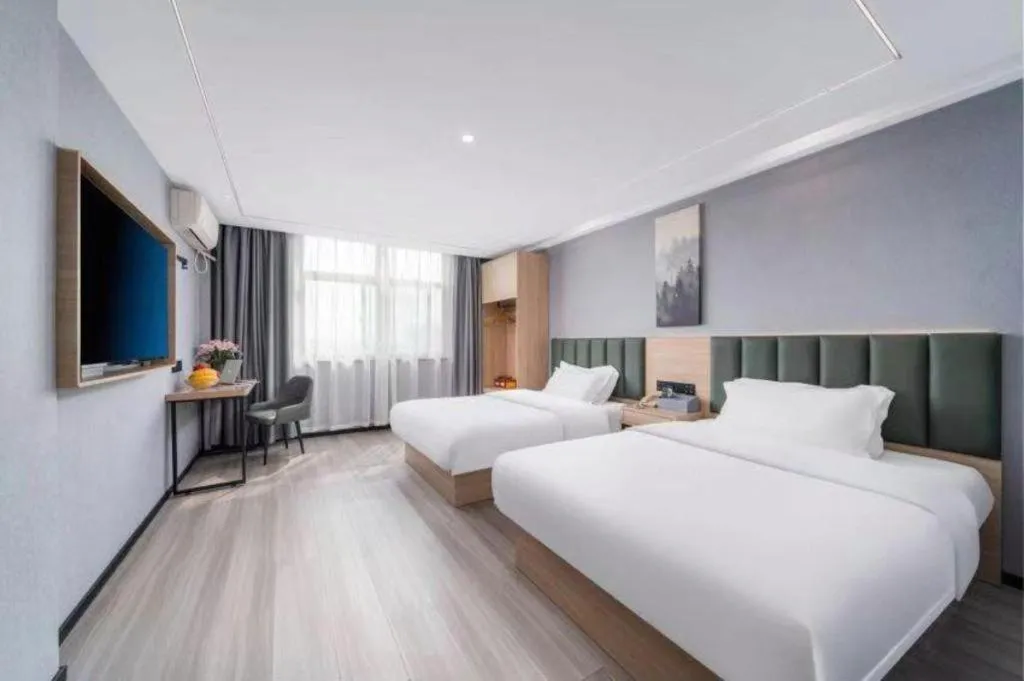 Bed in GreenTree Inn Taizhou Gaogang District Business Hotel