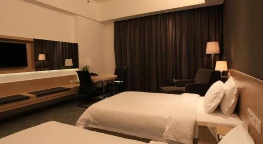 Bed in Hotel Maxmelim Beijing