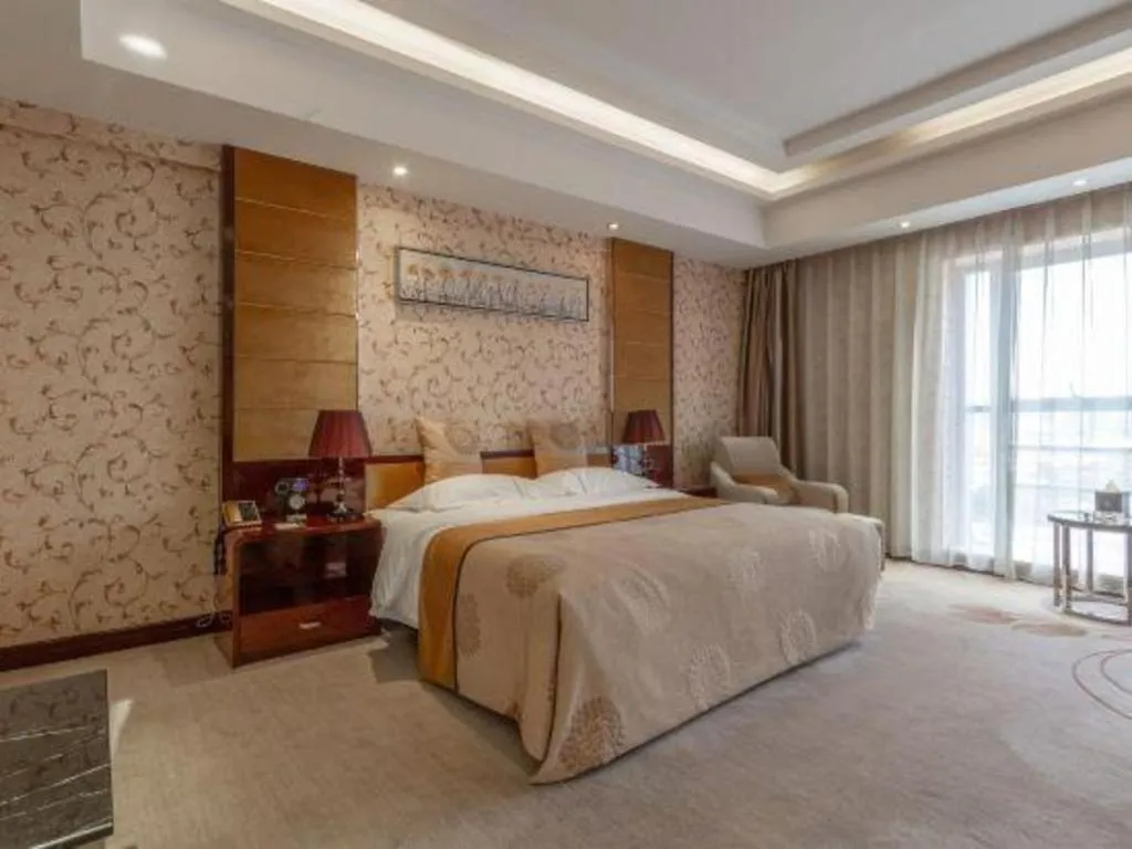 Bed in Xin Sheng Da Hong Sheng International Hotel